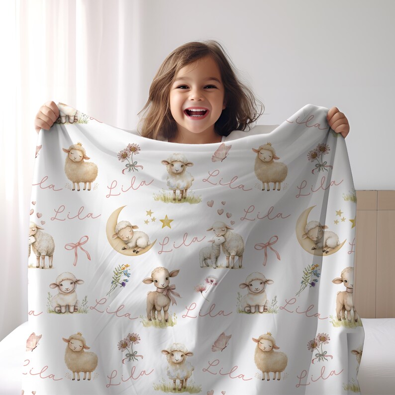 A girl holding a personalized custom name white velveteen blanket with whimsical lambs, pink bows, stars, flowers, hearts and butterflies.