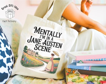 May include: A cream-colored canvas tote bag featuring a printed illustration of a person in period clothing holding a parasol in a landscape with a large house. The text reads, Mentally I'm in a Jane Austen Scene, in black lettering.
