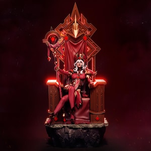 Puede incluir: Figura detallada de una mujer con un atuendo rojo y dorado, sentada en un trono. El trono es ornamentado con diseños geométricos y detalles rojos. La mujer tiene el pelo blanco y sostiene un bastón. El tema general es la fantasía.