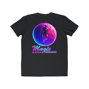 May include: Black t-shirt with a graphic of an astronaut in a neon pink and blue moon. The text "Magic Developed" is printed below the moon.
