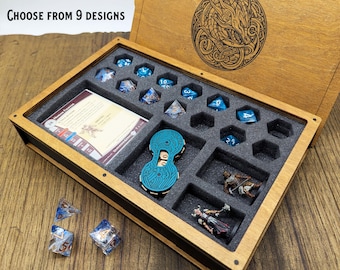 May include: Wooden dice box with a foam insert holding blue dice, game pieces, and a card. The box lid has an engraved design and the text "Choose from 9 designs".