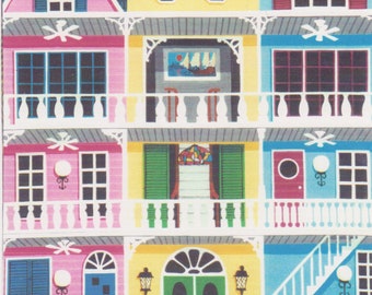 May include: A colorful illustration of a row of houses with white balconies and railings. The houses are painted in shades of pink, yellow, blue, and green. The illustration is titled "Key West".