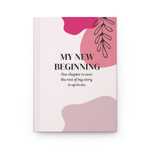 Könnte beinhalten: Ein rosa-weißer Journal-Umschlag mit abstrakten Formen und einem Blatt-Zweig-Design. Der Text auf dem Umschlag lautet "MY NEW BEGINNING. One chapter is over, the rest of my story is up to me."