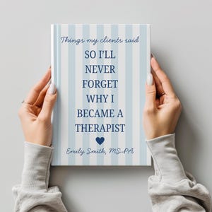 May include: A book with a blue and white striped cover is held by two hands. The book's title reads "Things my clients said" and includes the text "SO I'LL NEVER FORGET WHY I BECAME A THERAPIST." The author's name is also included.