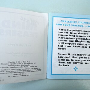 May include: A blue and white book with the title "Challenge Yourself and Your Friends...Again". The book is open to a page with text about the book's contents. The text includes the copyright information for the book.