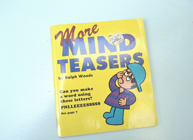 May include: A yellow book titled "More Mind Teasers" by Ralph Woods. The cover features a cartoon illustration of a person wearing a blue hat and a striped shirt, looking up and thinking. The book asks "Can you make a word using these letters? PNLLEEEESSSSS" and directs the reader to page 7.