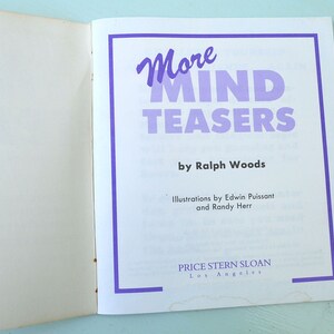 May include: A book cover with a purple title "More MIND TEASERS" by Ralph Woods. The book is published by Price Stern Sloan in Los Angeles.
