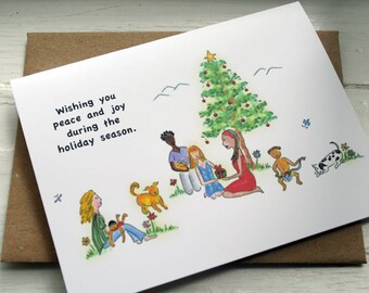 May include: A Christmas card with a hand-drawn illustration of a family gathered around a Christmas tree. The card reads "Wishing you peace and joy during the holiday season."