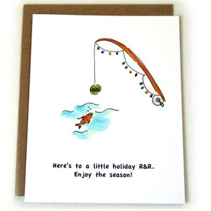 May include: A greeting card with a hand-drawn illustration of a fishing rod with Christmas lights, a red and green ornament, and a gold fish swimming in blue water. The text reads "Here's to a little holiday R&R. Enjoy the season!"