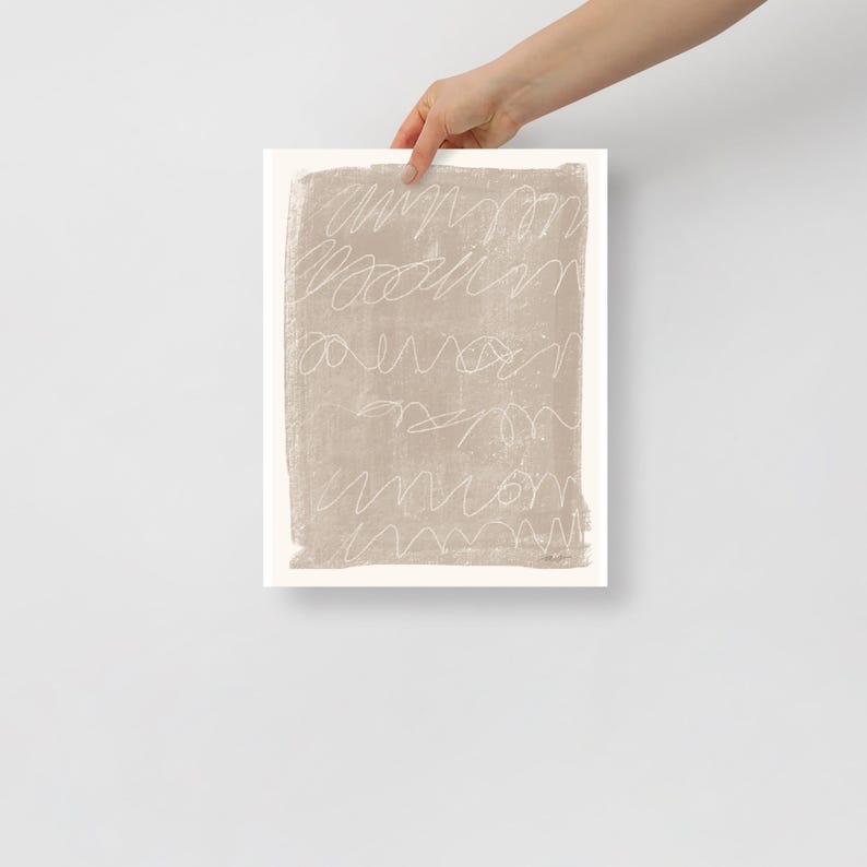 May include: A beige abstract art print with white lines and squiggles. The print has a textured look and feel.