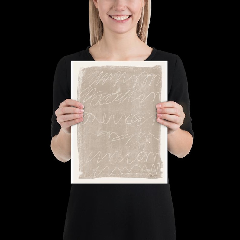 May include: A beige abstract print with white lines. The print is on a white background and is framed.