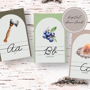 May include: Three educational flashcards featuring watercolor illustrations of an axe, blueberries, and a campfire. Each card displays the corresponding uppercase and lowercase letters A, B, and C in cursive script with the text digital download.