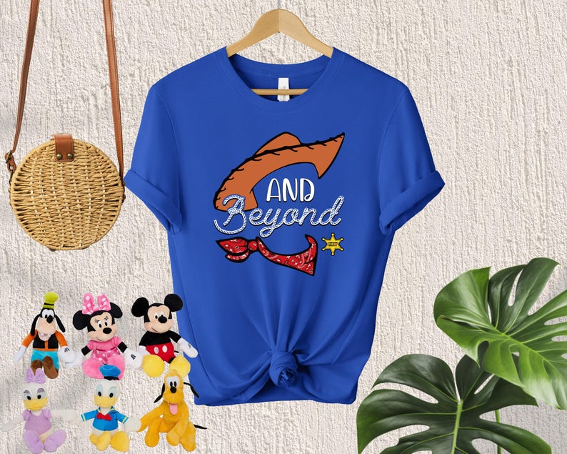May include: A royal blue t-shirt with a cartoon image of a cowboy hat and the text "AND BEYOND".