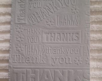 Tovaglioli di carta per ospiti con scritta "Grazie" in rilievo, formato 10 x 20 cm, confezione da 50 pezzi.