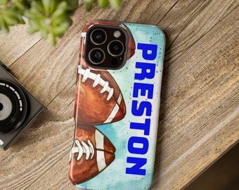 May include: A phone case featuring a watercolor design of two footballs in shades of brown and white, set against a light blue background. The name "PRESTON" is printed vertically in bold blue letters.