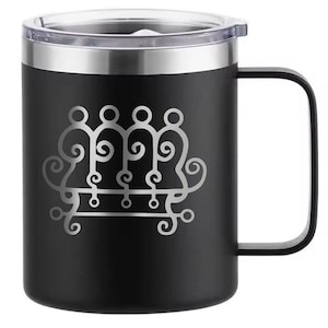 May include: Black travel mug with a silver rim and handle. The mug features a silver decorative design on the front. The mug has a clear plastic lid. The mug is designed to keep beverages hot or cold.