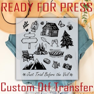 May include: A white DTF transfer featuring black camping-themed illustrations, including a cabin, campfire, mountains, and a signpost. The text "READY FOR PRESS" is at the top, and "Custom Dtf Transfer" is at the bottom. The phrase "Just Trial Before the Veil" is also included.
