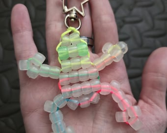 Color changing frog keychain, Sun reactive and Glows in the dark. Green eyes