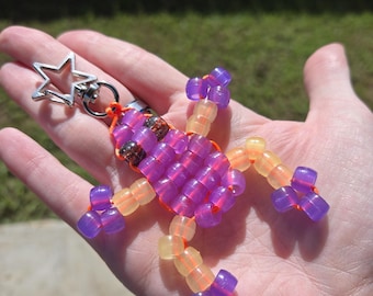 Color changing frog keychain, Sun reactive and Glows in the dark. Orange cording