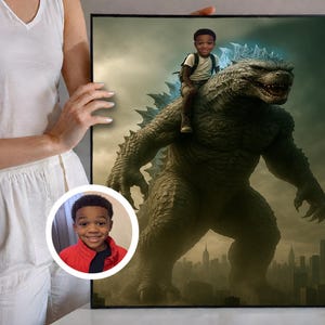 May include: A framed print featuring a digitally created image of a young boy riding on the back of a Godzilla-like monster. The monster is green and gray, with the boy wearing a backpack. The background shows a city skyline.