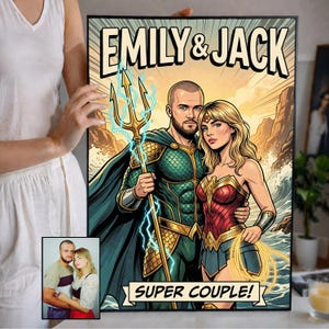 May include: A framed comic-style portrait featuring a couple as superheroes, with the names "EMILY & JACK" at the top and "SUPER COUPLE!" at the bottom. The male figure is dressed as Aquaman, and the female figure is dressed as Wonder Woman.