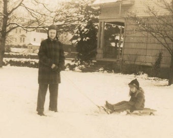 Vintage photo 1945 Boy Pilot Pulls little Sister sled Snow