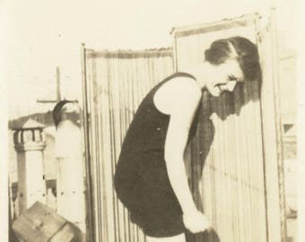 vintage photo 1924 lady in bathing suit and garters tries to hide~modesty screen behind her