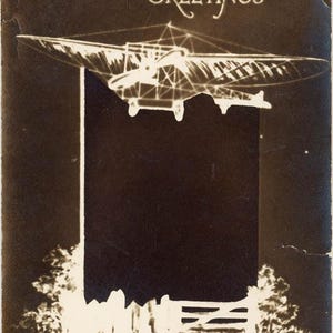 May include: Vintage sepia-toned postcard with the word "GREETINGS" in elegant script. An early aircraft design is depicted above a dark rectangular space, with a stylized landscape at the bottom. The image has a classic, aged aesthetic.