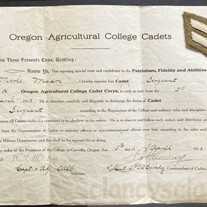 May include: A black and white document with the text "Oregon Agricultural College Cadets" at the top. The document is a certificate appointing Merle Moore as a Cadet Sergeant in the Oregon Agricultural College Cadet Corps, dated March 1912.
