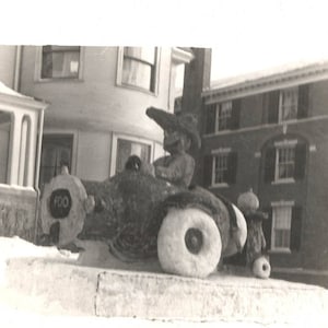 vintage photo Giant Snow Sculpture Man in CAr