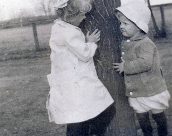 Vintage photo 1917 Darling Girl Looks Around Tree at Little Boy 11 L