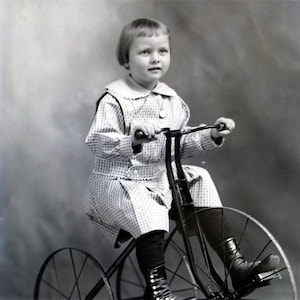 Vintage photo print Little Girl Rides Old Fashioned Tricycle fine art photograph