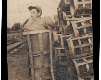 vintage photo Young Man Squeezed into a basket unusual Vintage Snapshot