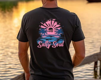 May include: Black t-shirt featuring a pink and blue graphic of a sunset over a beach with palm trees and the text "Salty Soul".