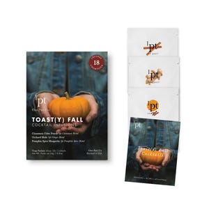 May include: A collection of cocktail infusion packets and a box with the text "TOAST(Y) FALL COCKTAIL INFUSIONS." The box features a small orange pumpkin held in hands. The packets include cinnamon, ginger, and orange spice blends.