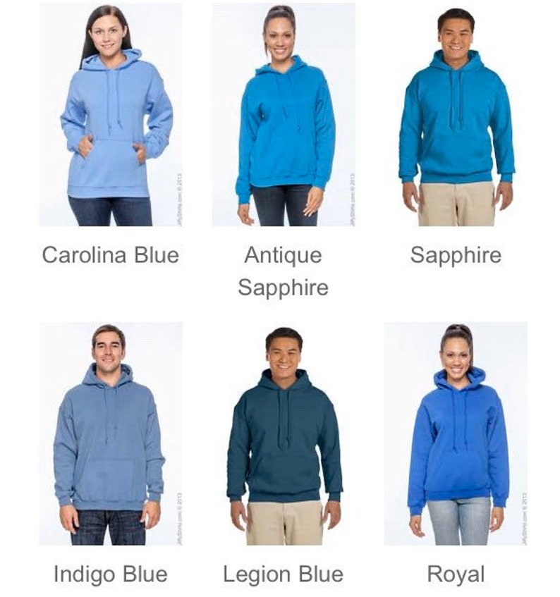 May include: A collection of hooded sweatshirts in various shades of blue, including Carolina Blue, Antique Sapphire, Sapphire, Indigo Blue, Legion Blue, and Royal. Each hoodie features a front pocket and a drawstring hood.