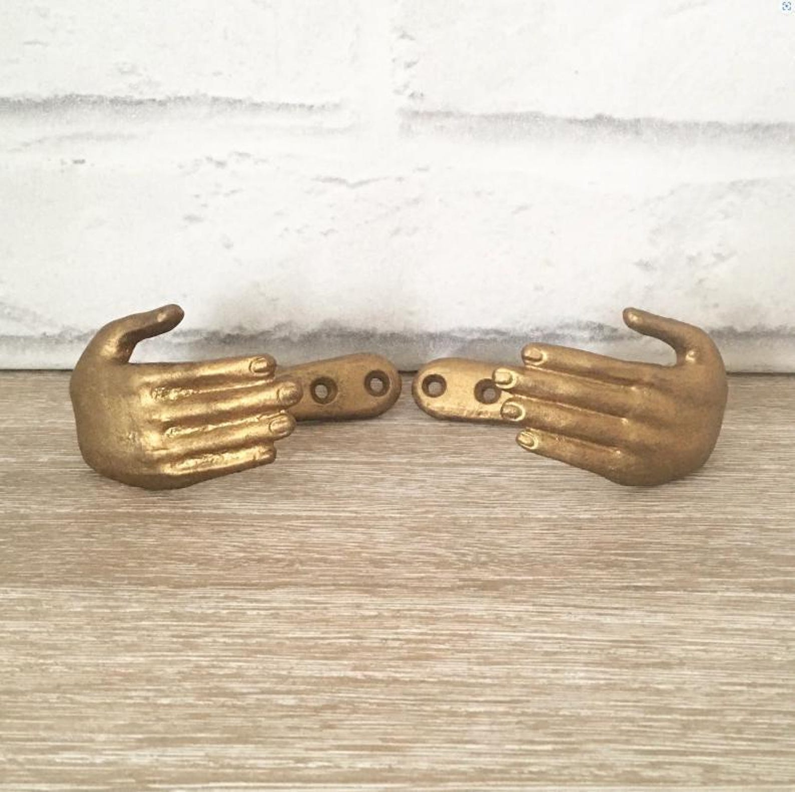 Pair of 2- Gold Hands Curtain Hooks