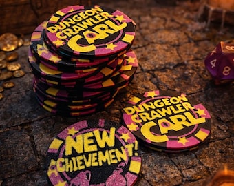 May include: A stack of black, pink, and yellow game tokens with the text "DUNGEON CRAWLER CARL" and "NEW ACHIEVEMENT!" on them. The tokens are round and have a star design. The image has a fantasy theme.