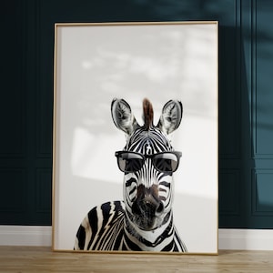 May include: A black and white zebra with a mohawk wearing black sunglasses against a white background.
