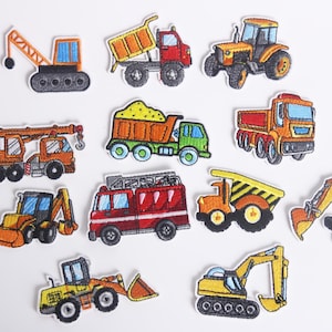May include: Set of 10 embroidered iron-on patches featuring various construction vehicles, including a crane, dump truck, excavator, and bulldozer. The patches are colorful and detailed, with a cartoon-like style.