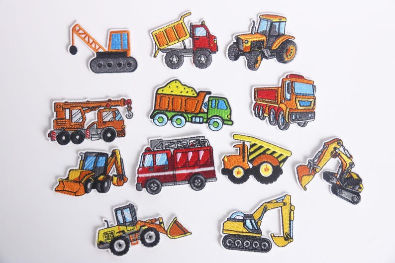 May include: Set of 10 embroidered iron-on patches featuring various construction vehicles, including a crane, dump truck, excavator, and bulldozer. The patches are colorful and detailed, with a cartoon-like style.