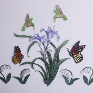 Peut inclure: Patchs brodés thermocollants avec une variété de motifs floraux et animaux. Les patchs comprennent un papillon, des colibris, des lys et des fleurs de muguet.