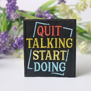 May include: Black embroidered iron-on patch with the text "QUIT TALKING START DOING" in a colorful neon-style font.