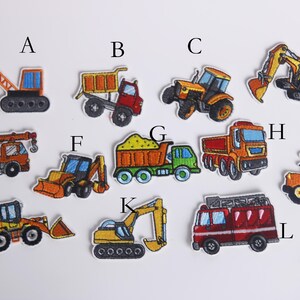 May include: Ten colorful iron-on patches featuring different types of construction vehicles, including a crane, dump truck, tractor, excavator, bulldozer, and a fire truck.