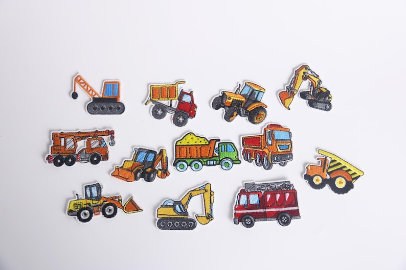 May include: A set of ten colorful iron-on patches featuring different types of construction vehicles, including a crane, dump truck, bulldozer, excavator, and a fire truck.