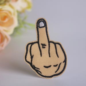 långfingerlapp, knulla av-lapp, stryklapp, broderad lapp, rolig lapp, cool lapp