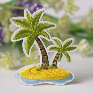 May include: Embroidered patch showing a tropical island. The design features two palm trees with green leaves and brown trunks on a yellow island with blue water. The patch has a white border.