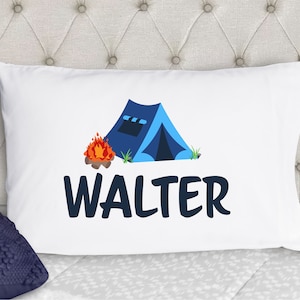 May include: White pillowcase with a blue tent, orange campfire, and green grass illustration. The text "WALTER" is printed in blue below the illustration.