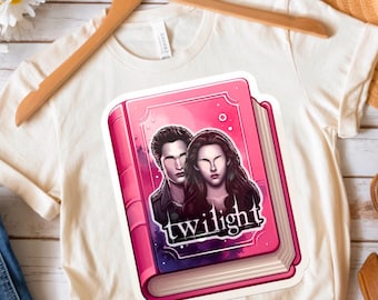 May include: A pink book with a stylized illustration of two people on the cover. The book is titled "twilight" in a white font.