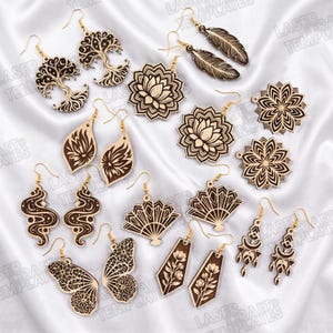 May include: A collection of laser-cut wooden earrings featuring various designs including trees of life, feathers, lotus flowers, fans, butterfly wings, floral patterns, and geometric shapes, all equipped with gold-toned metal earring hooks.